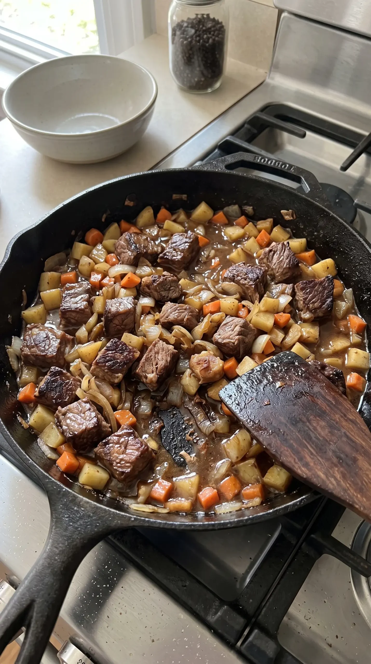 Browning chuck roast with vegetables while building a savory beef pot pie filling