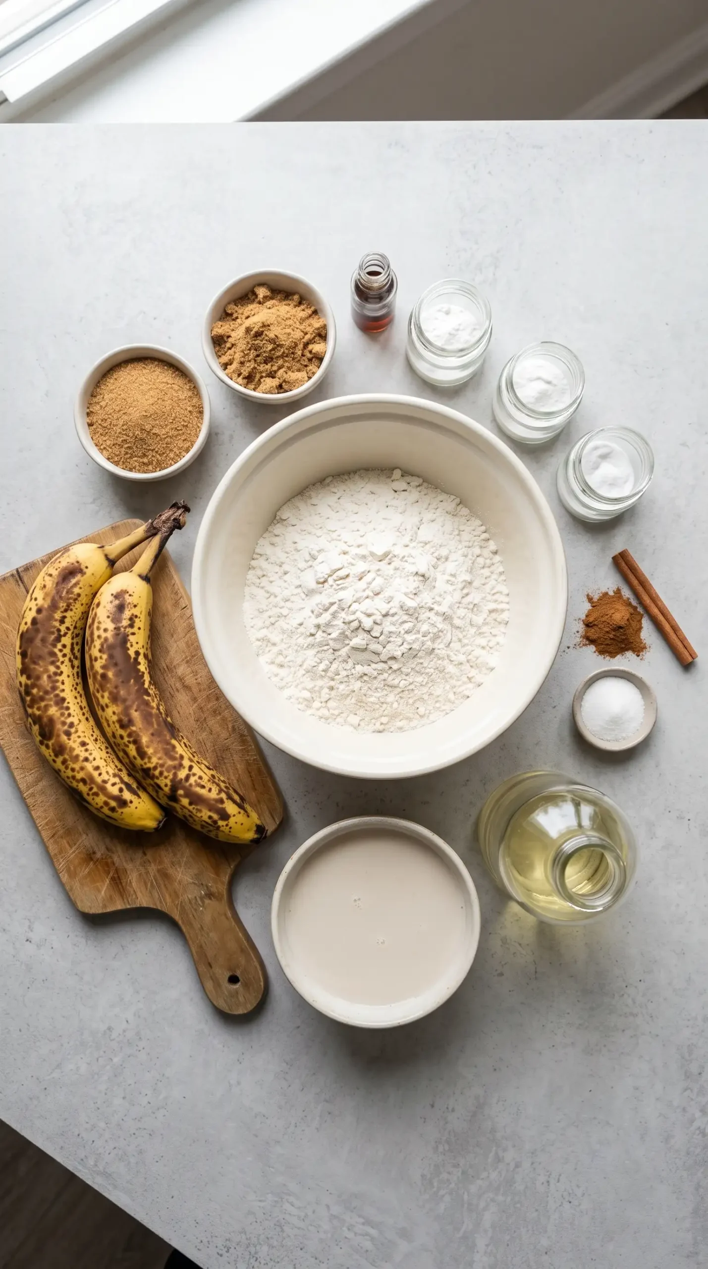 Ingredients for vegan banana bread with ripe bananas and plant-based milk